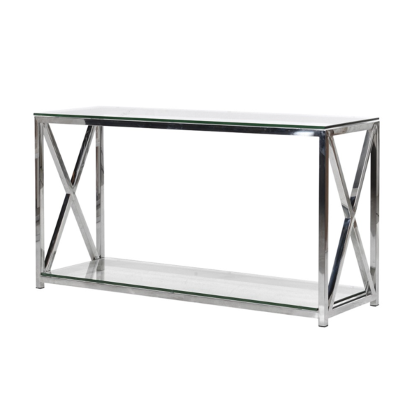 This sleek and modern console table measures H 70 cm, L 130 cm, and D 40 cm. It features a sturdy chrome frame with a minimalist design. The top and bottom surfaces are made of clear glass, adding an elegant and airy feel. A practical lower shelf provides extra storage or display space, while the bold cross design on each end of the frame adds a striking geometric detail. This table combines functionality with style, making it a perfect addition to contemporary interiors.